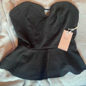 Size small or medium avaliable black shirt with silver sparkles NWT